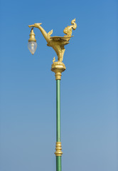 Fototapeta na wymiar Pole lantern with golden swan decoration