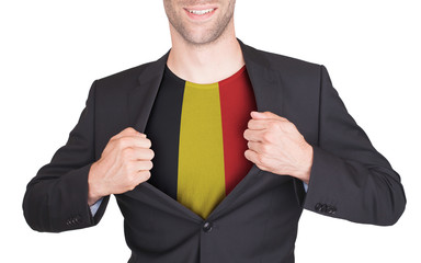 Businessman opening suit to reveal shirt with flag