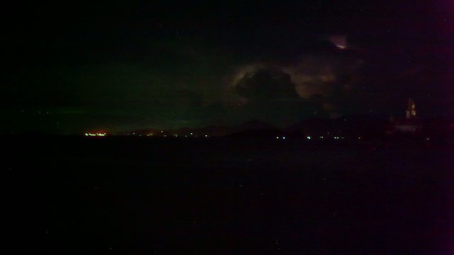 Lightning in the sea during the night time. Time lapse video