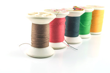 Macro picture of yarn bobbins of different colors