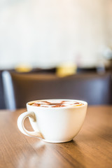 Coffee cup in coffee shop interior