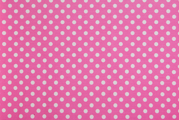 while dots on pink background