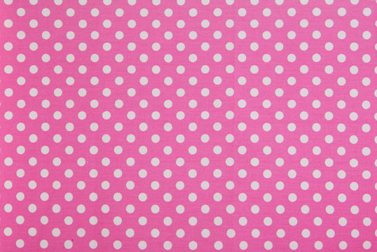 while dots on pink background