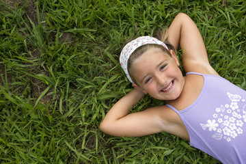Girl lying in grass