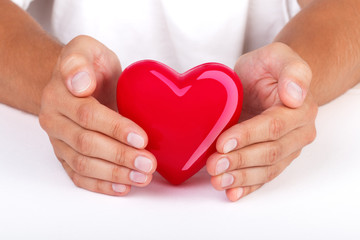 Hands protecting heart