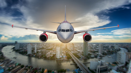 Passenger airplane landing on runway in airport