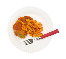 Breaded chicken and pasta TV dinner on paper plate with fork