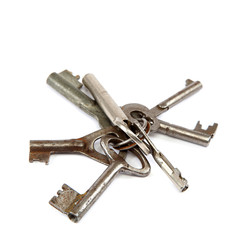 Old keys on a white background.