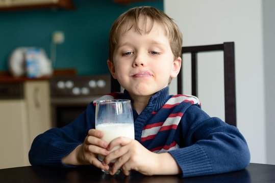 Boy with glass of delicious  milk