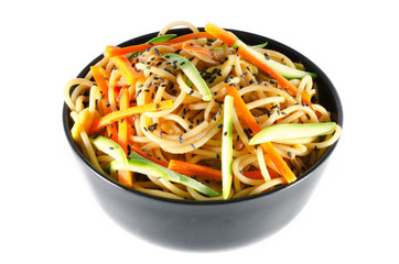 Serving of spaghetti with carrots and zucchini and soy sauce and
