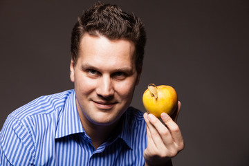 Diet nutrition. Happy man holding apple fruit