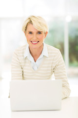 middle aged businesswoman with laptop