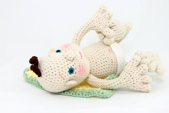 Crocheted Baby Doll On Back With Feet Up
