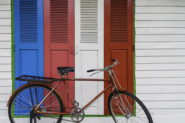 vintage bicycle in colorful door background
