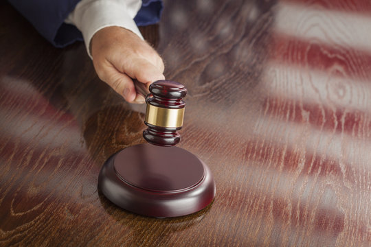 Judge Slams Gavel and American Flag Table Reflection