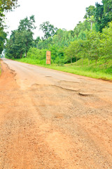 Dilapidated asphalt road © mikumistock