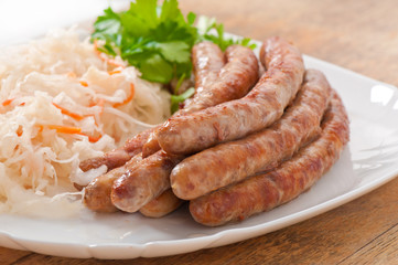 Bavarian fried sausages on sauerkraut