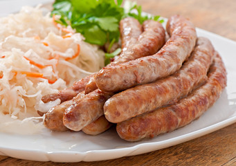 Bavarian fried sausages on sauerkraut