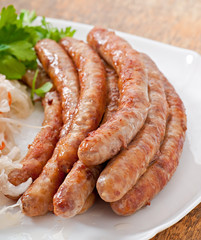 Bavarian fried sausages on sauerkraut