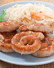 Bavarian fried sausages on sauerkraut