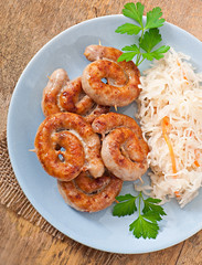 Bavarian fried sausages on sauerkraut