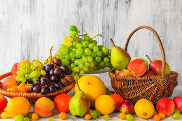 Wooden table full fresh fruit baskets