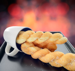 three breads twists with glass on red bokeh light background