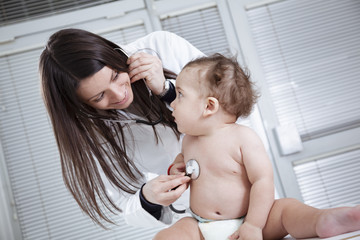 Pediatrician doing checkup on baby