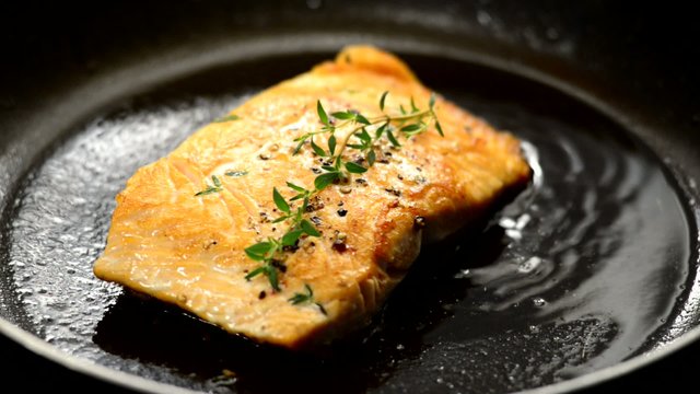 Fresh salmon steaks cooking for a healthy nutritious family meal
