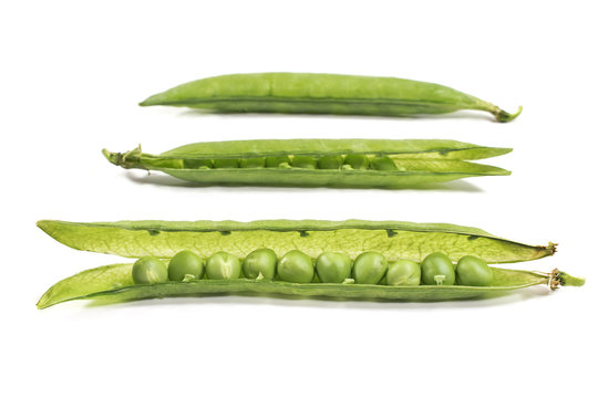 Fresh green peas on a white