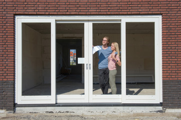 Young couple on construction site