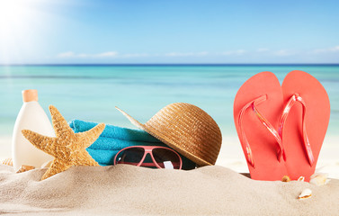 Sandy beach with accessories and blur sea