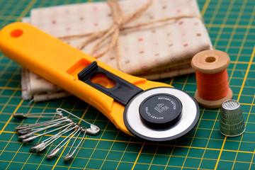 Patchwork sewing tools on green mat
