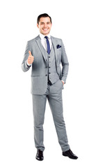 Businessman showing OK sign with his thumb up. 