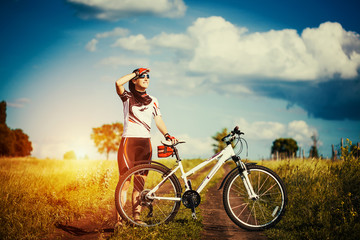 Young Woman is riding bicycle outside. Healthy Lifestyle
