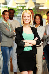 Smiling young businesswoman standing