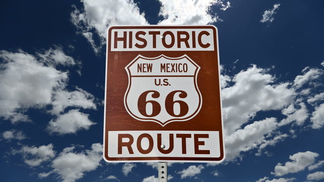 Route 66 Sign with Time Lapse Clouds