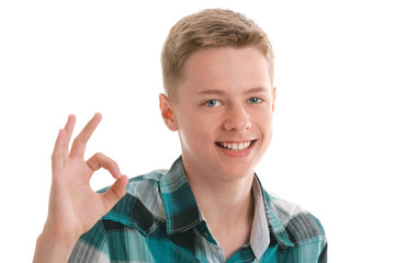 A smiling teen showing ok sign