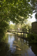 Fototapeta na wymiar Wooden bridge spanning the River Test Hampshire England UK