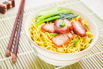 Yellow noodles with roasted pork and vegetable