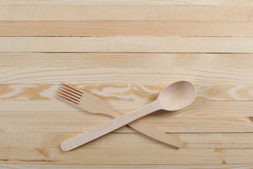 Wooden spoon and fork on wooden boards