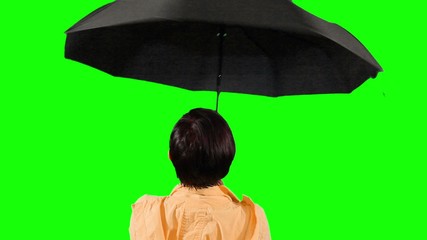 Close-up of a woman opens an umbrella. Green screen.
