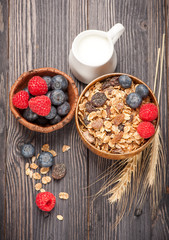 Homemade granola muesli with berries and milk