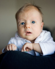 Blond newborn baby with blue eyes