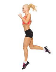sporty woman running or jumping