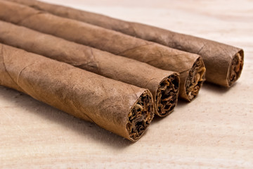 Cigars  on wooden table