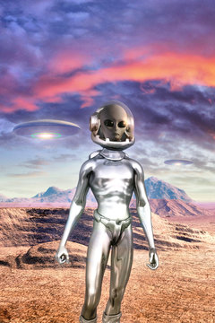 Gray alien and UFO in the desert