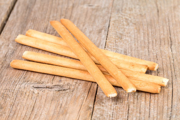 bread sticks grissini on wooden background