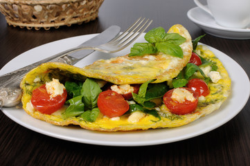 Omelet with spinach, basil, cherry tomatoes and cheese Adyg