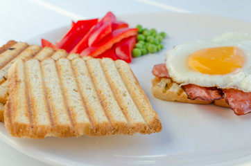Fresh breakfest - ham, eggs, vegetable and toast